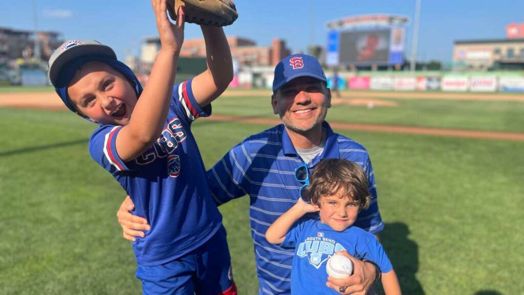 Matt Landry and sons on the South Bend Cubs field